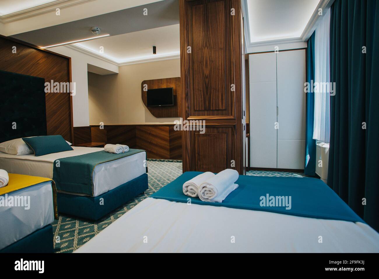 A cozy and modern hotel room with two separate beds Stock Photo - Alamy