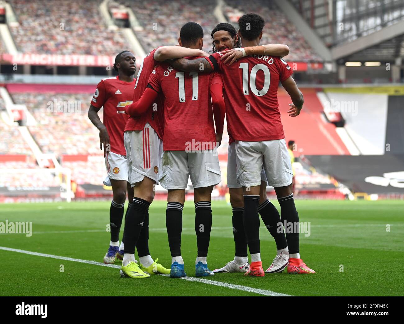 Manchester United's Mason Greenwood celebrates scoring their side's first goal of the game with Marcus Rashford during the Premier League match at Old Trafford, Manchester. Picture date: Sunday April 18, 2021. Stock Photo