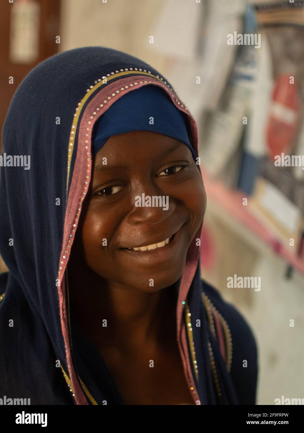 Dodoma, Tanzania. 10-10-2018. Portrait of a beautiful and smiling black muslim young woman waiting at the hospital for assistance. Stock Photo