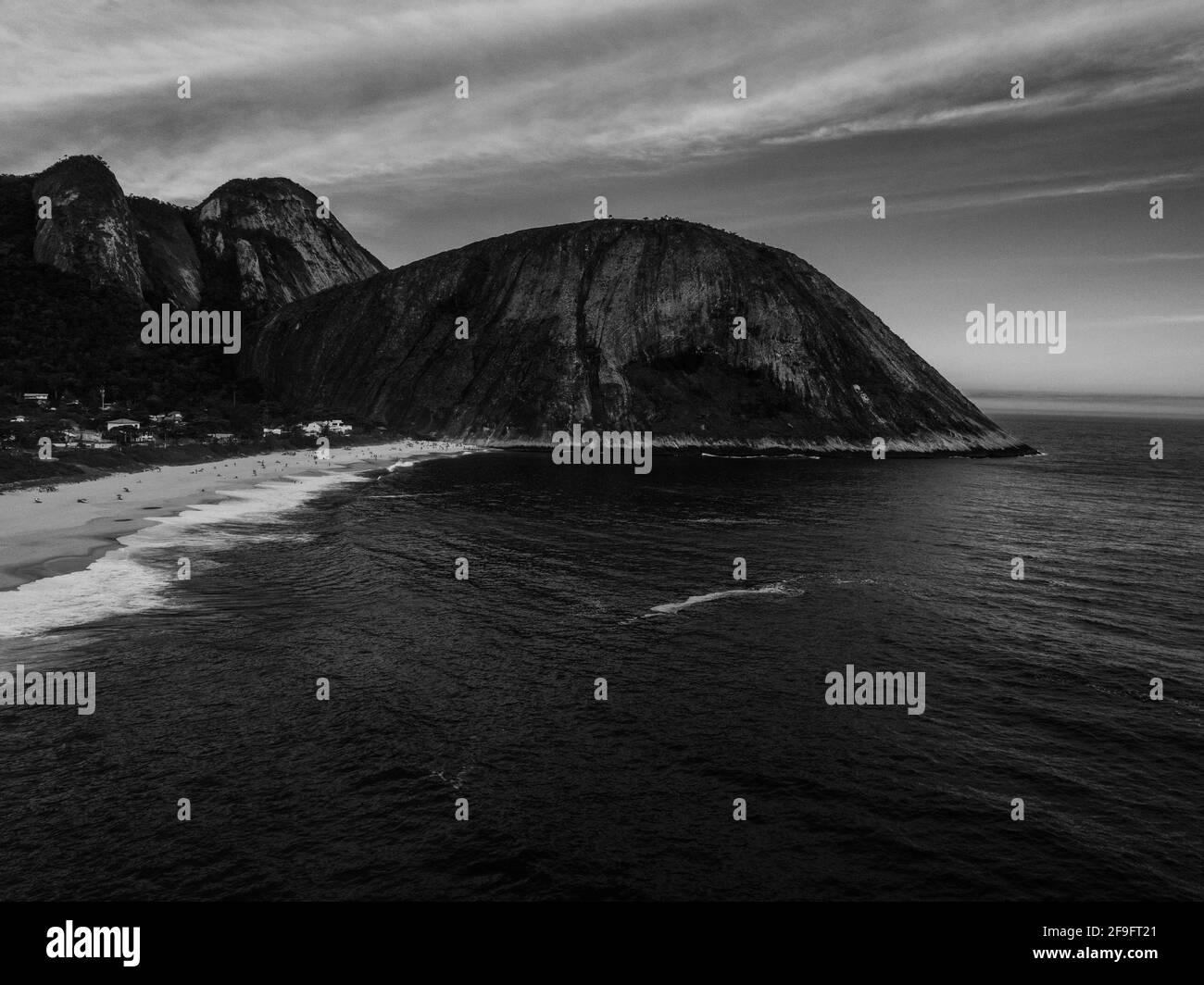 A black and white shot of small beach Itacoatiara, Regiao Brazil Stock Photo