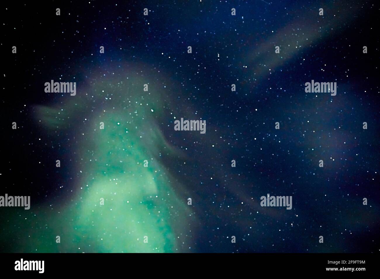 The Green Lady Dances is the  Sami name for the Lights and in this image you can see a green lady dancing in the sky Stock Photo