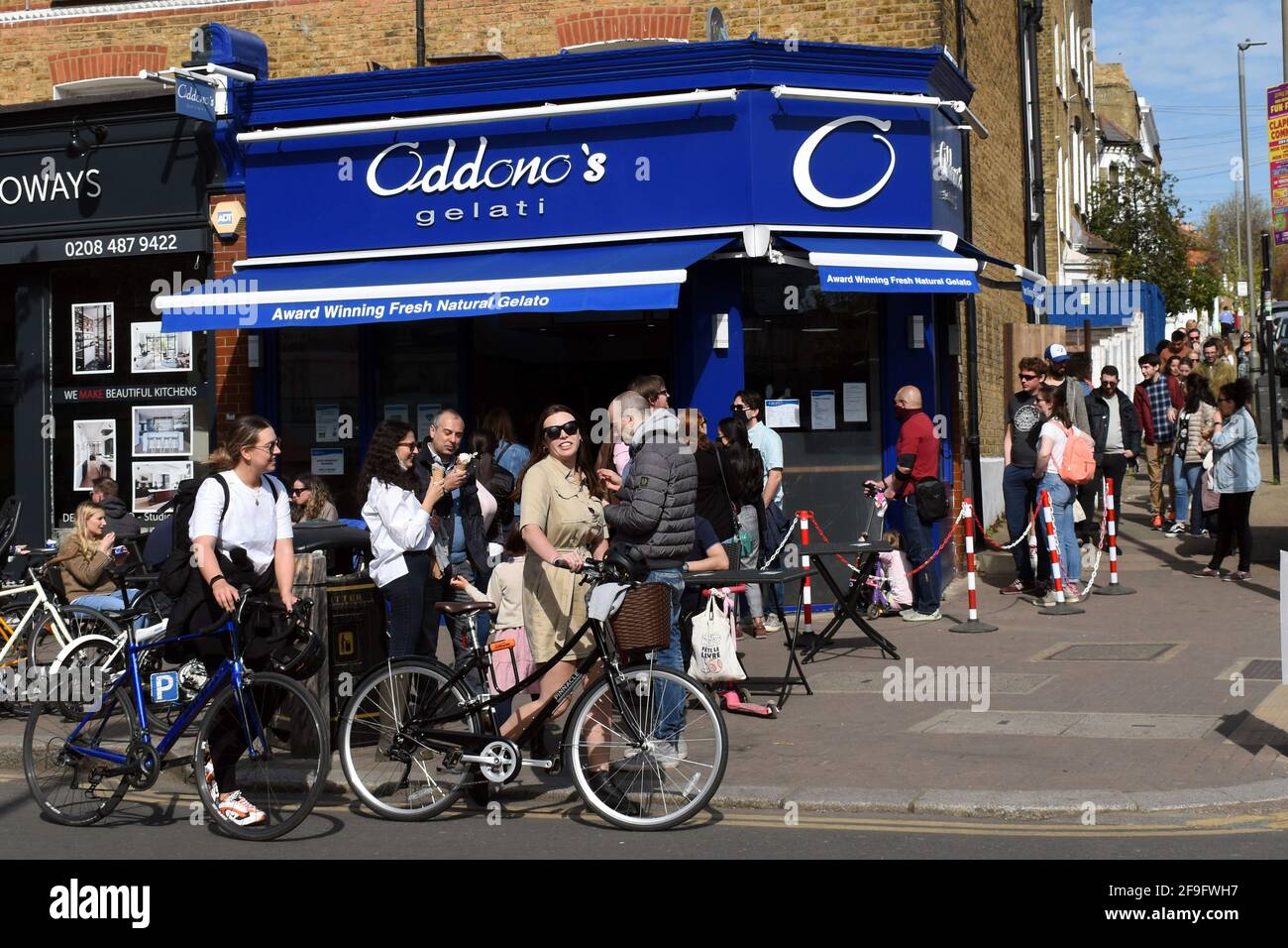 London, UK. 18th Apr, 2021. Oddono's Gelati Italiani. Northcote road pedestrianised to allow businesses to recover after lockdown. Sunshine on Sunday as pubs and restaurants open to the crowds. Credit: JOHNNY ARMSTEAD/Alamy Live News Stock Photo