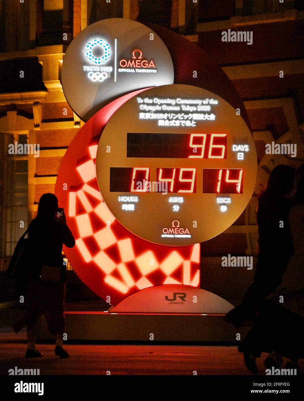 Hachioji, Japan. 18th Apr, 2021. Pedestrian take a photo big countdown clock for the Tokyo 2020 Olympics at Tokyo Station in Tokyo, Japan on Sunday, April 18, 2021. Photo by Keizo Mori/UPI Credit: UPI/Alamy Live News Stock Photo