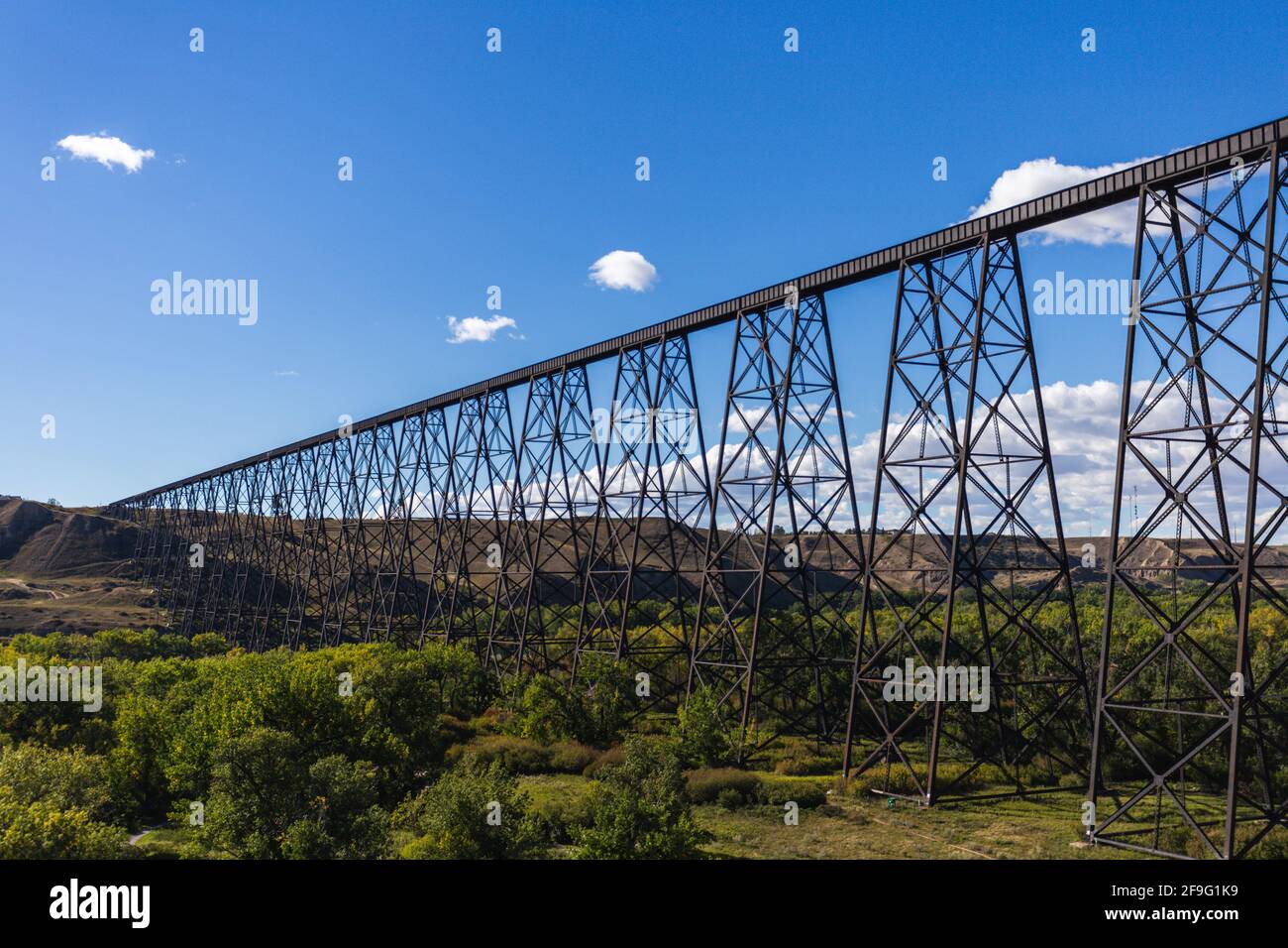 super long railroad bridge in a valley in summer with blue sky Stock