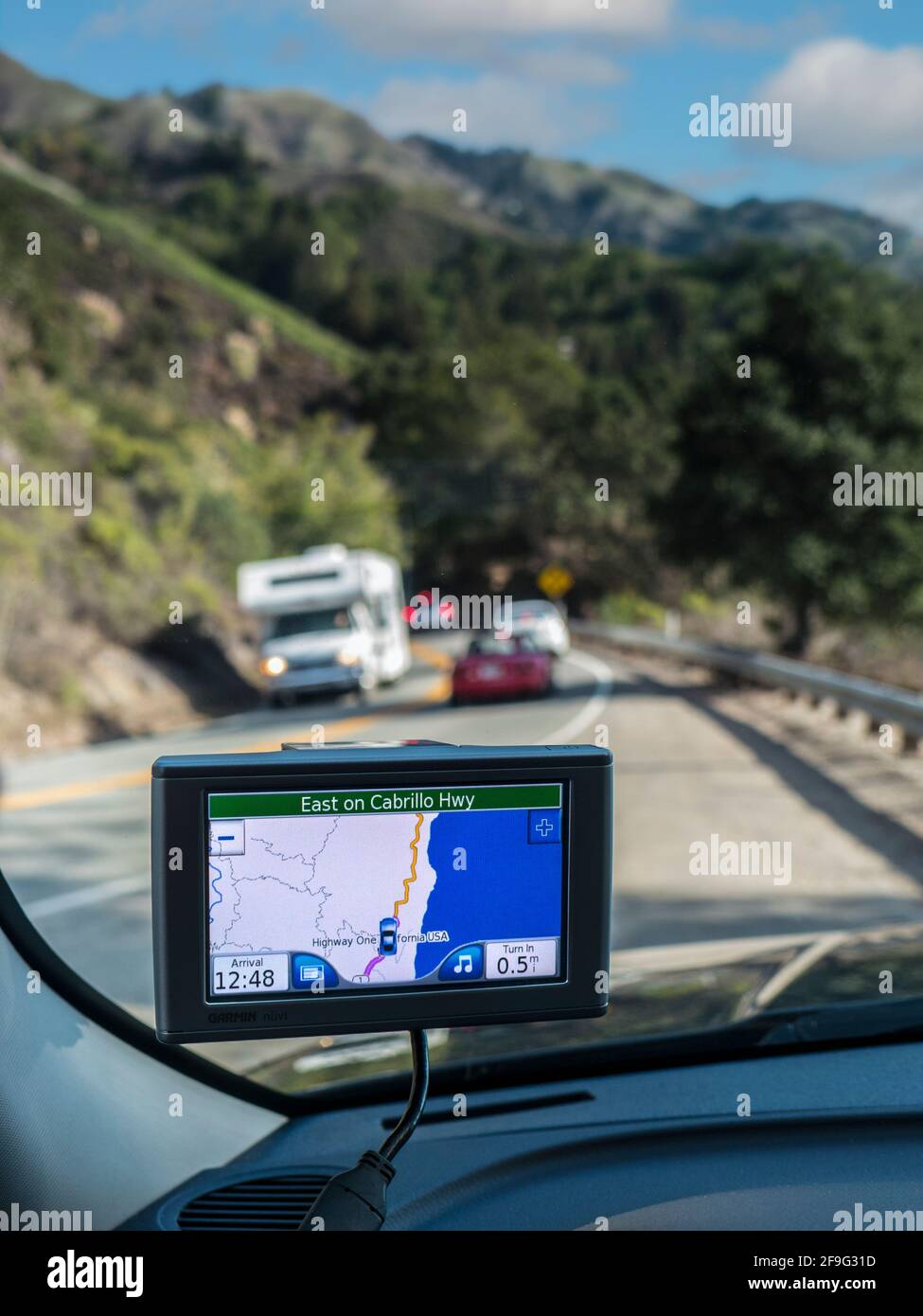 California Sat Nav HIGHWAY ONE Satellite Navigation Screen SatNav Sat Nav displaying Highway 1 One, East on Cabrillo Highway with cars and Motorhome RV on vacation tour drive on popular coastal Pacific route.  Monterey, Pacific Ocean, California USA Stock Photo
