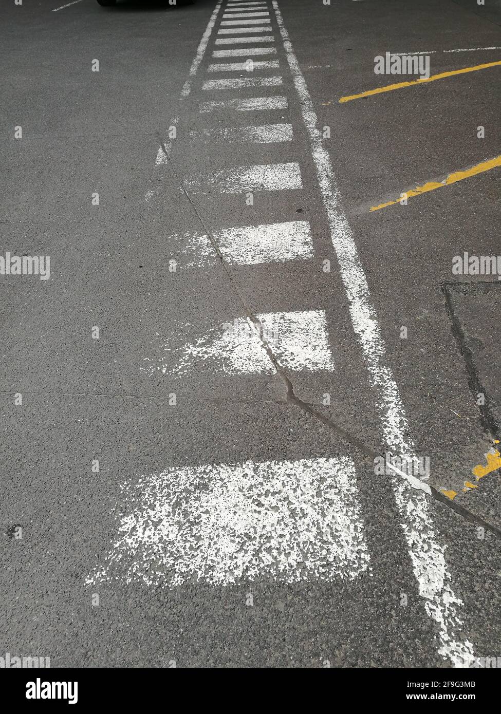 A vertical shot of asphalt with road markings Stock Photo - Alamy