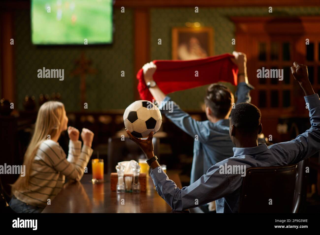 Football fans watching game translation in bar Stock Photo Alamy