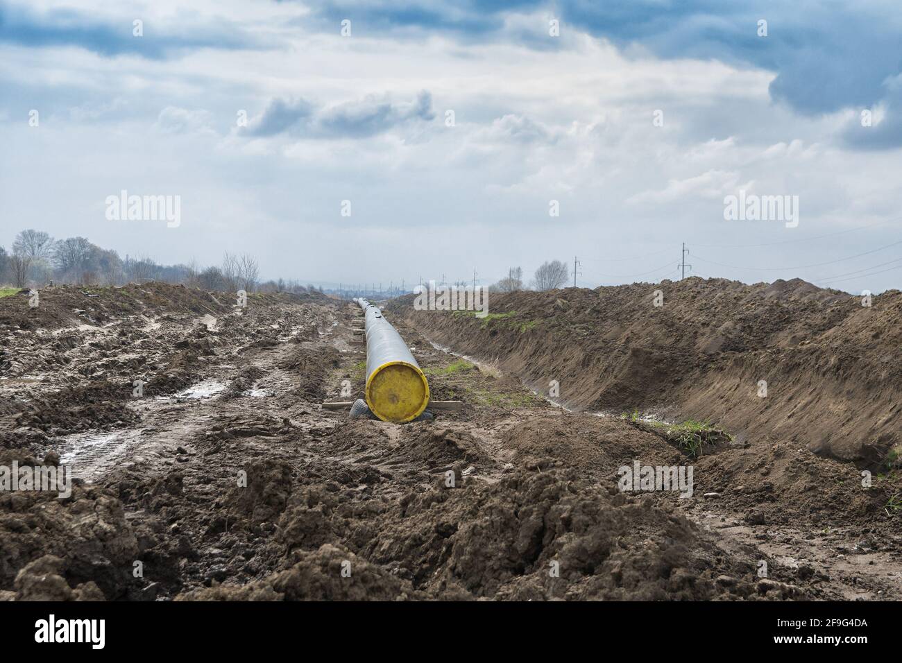 Natural gas pipeline construction work. A dug trench in the ground for