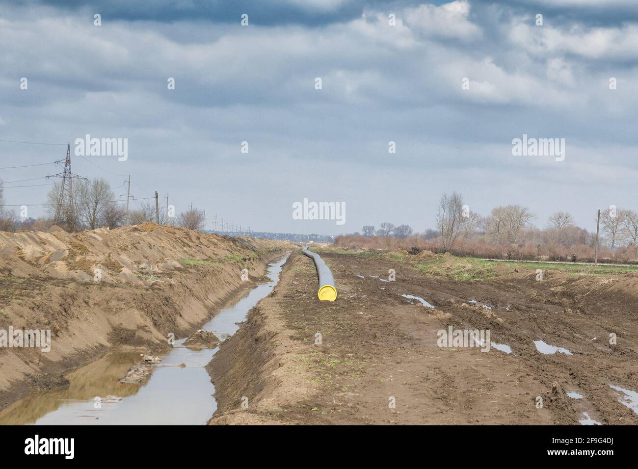 Natural gas pipeline construction work. A dug trench in the ground for