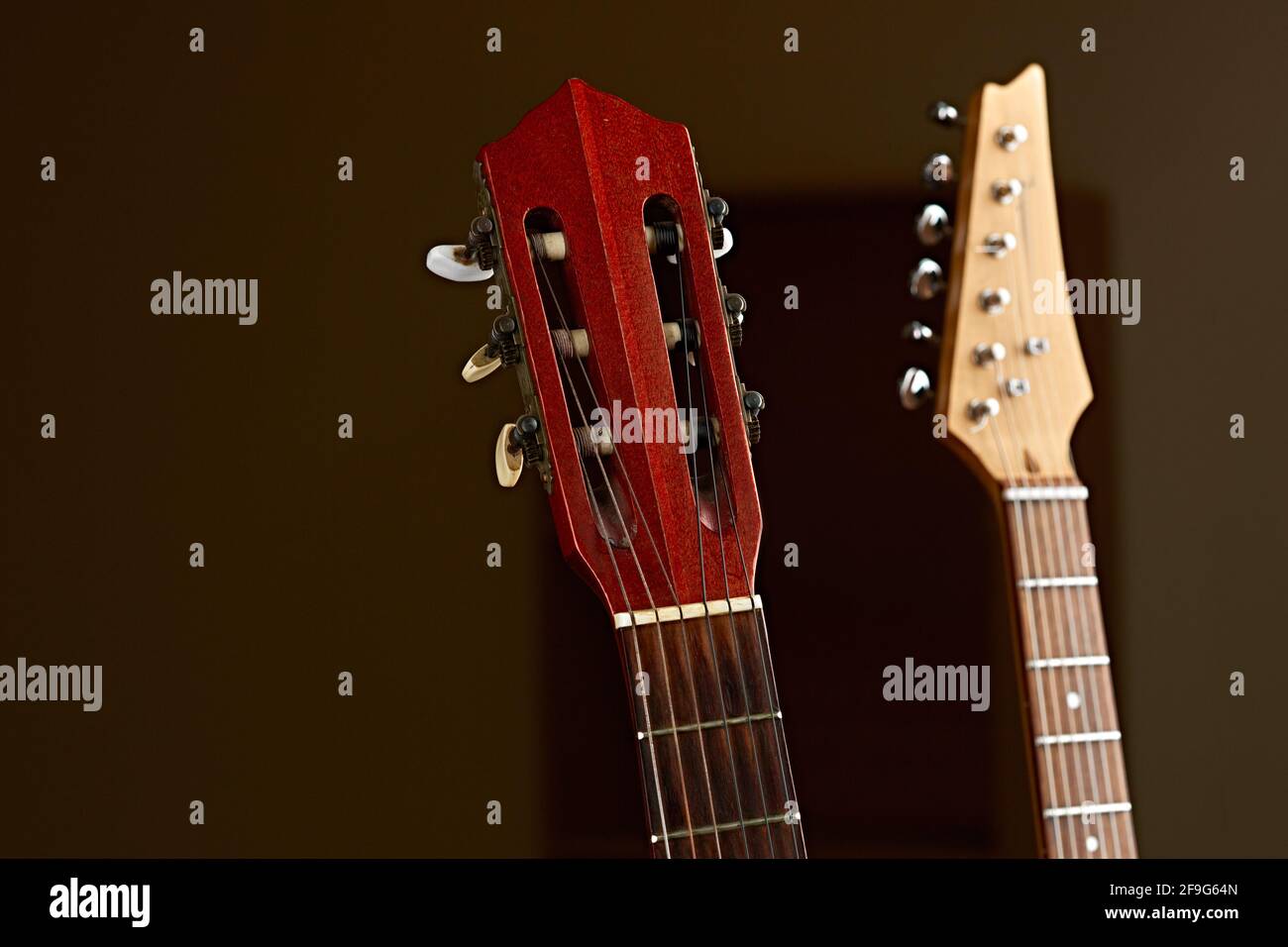 Electric and classical acoustic guitar fretboards Stock Photo Alamy