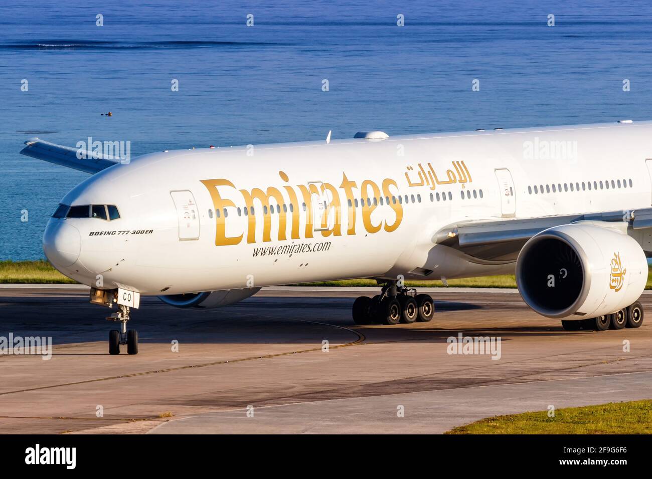 Mahe, Seychelles - November 26, 2017: Emirates Boeing 777 airplane at Seychelles International Airport  (SEZ) in the Seychelles. Boeing is an American Stock Photo
