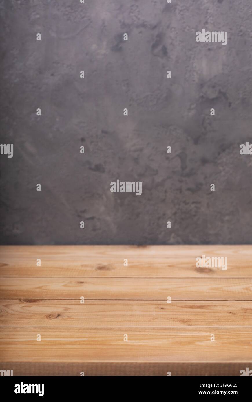 wooden table or tabletop near wall background, front low angle view