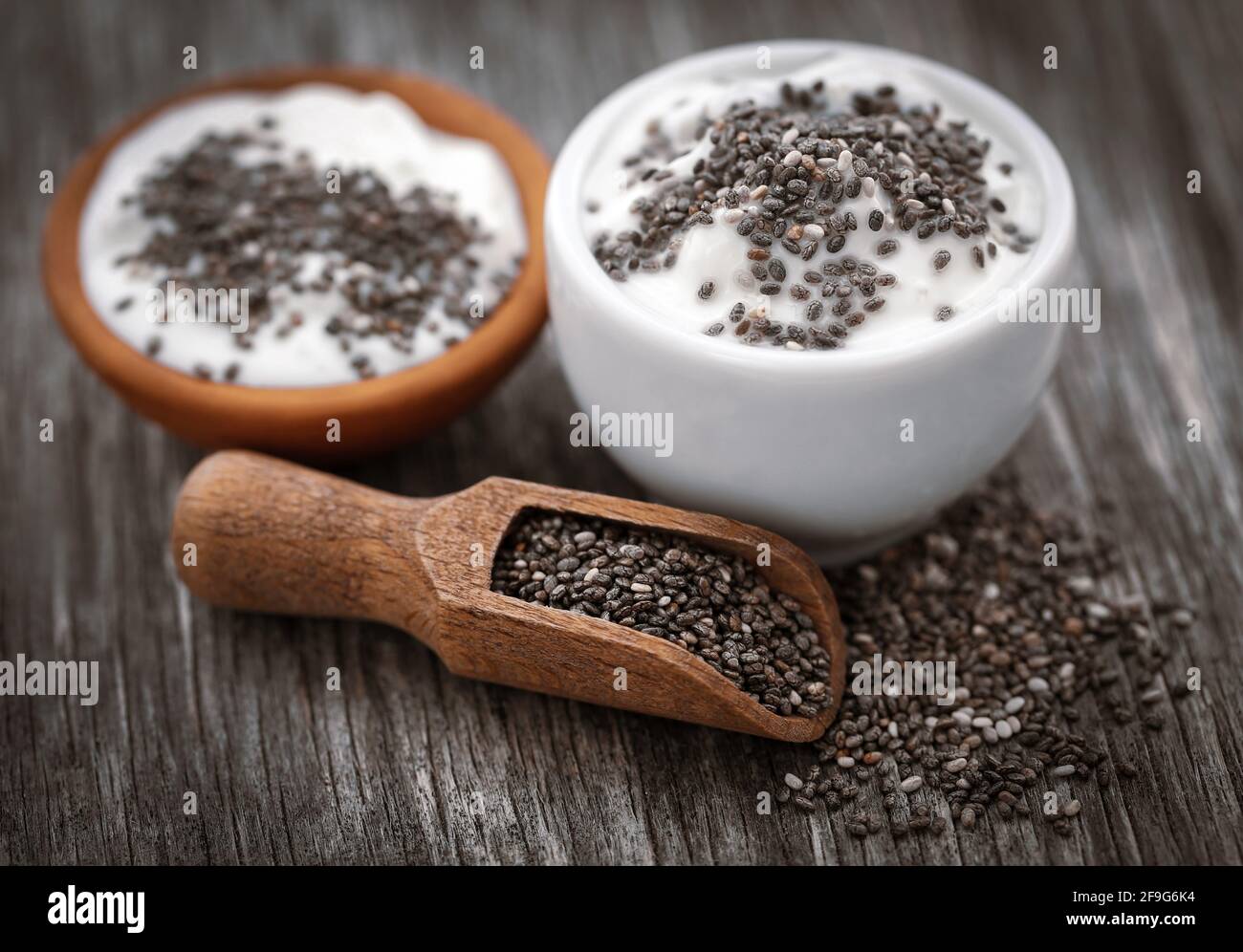 Yogurt with chia seeds on natural surface Stock Photo Alamy