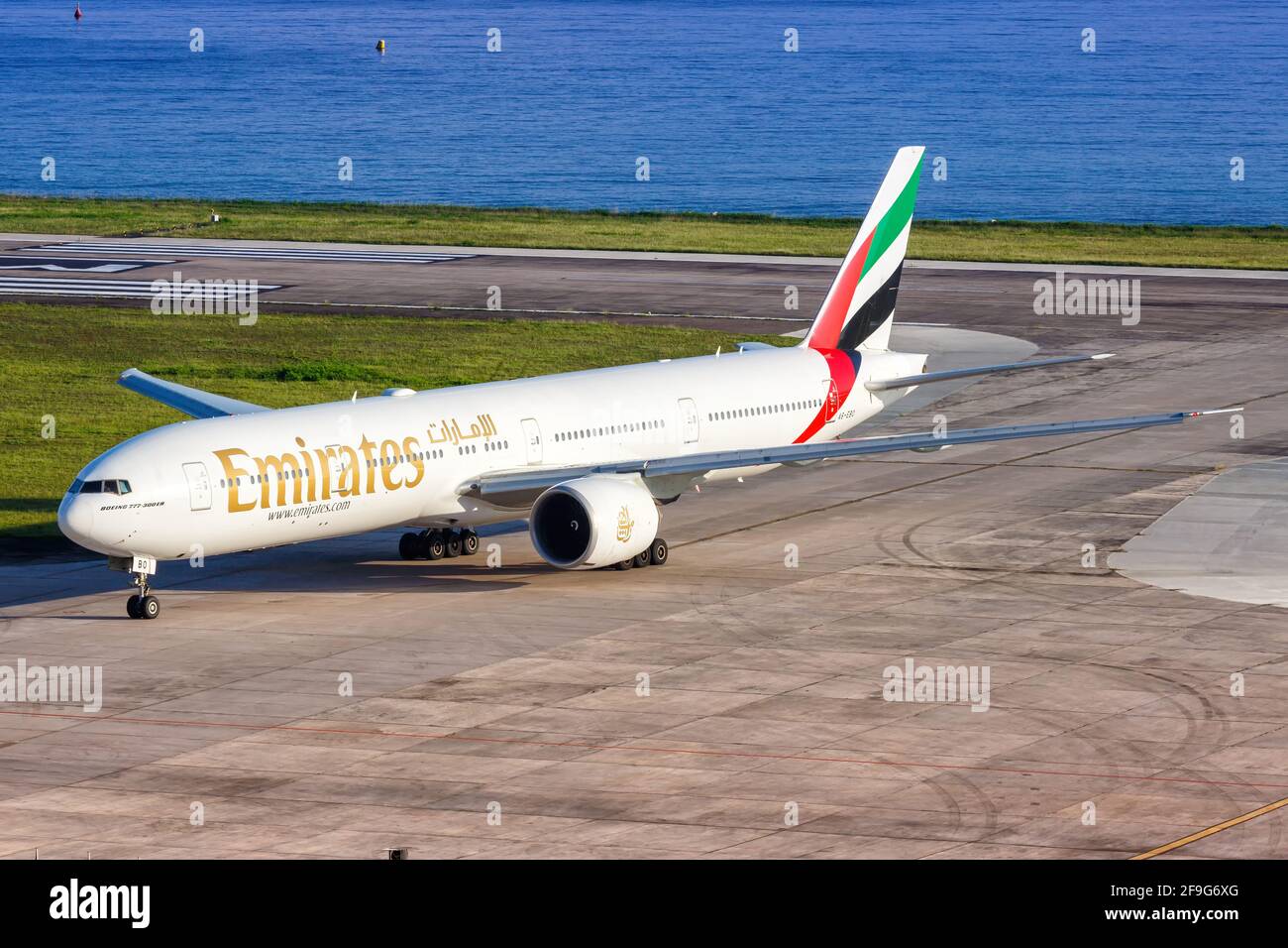 Mahe, Seychelles - November 24, 2017: Emirates Boeing 777 airplane at Seychelles International Airport (SEZ) in the Seychelles. Boeing is an American Stock Photo