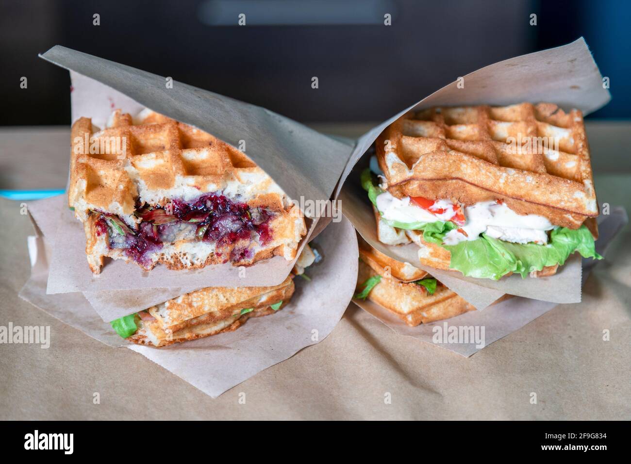 Several fresh sandwiches in paper bags. Sandwich filet americain, close