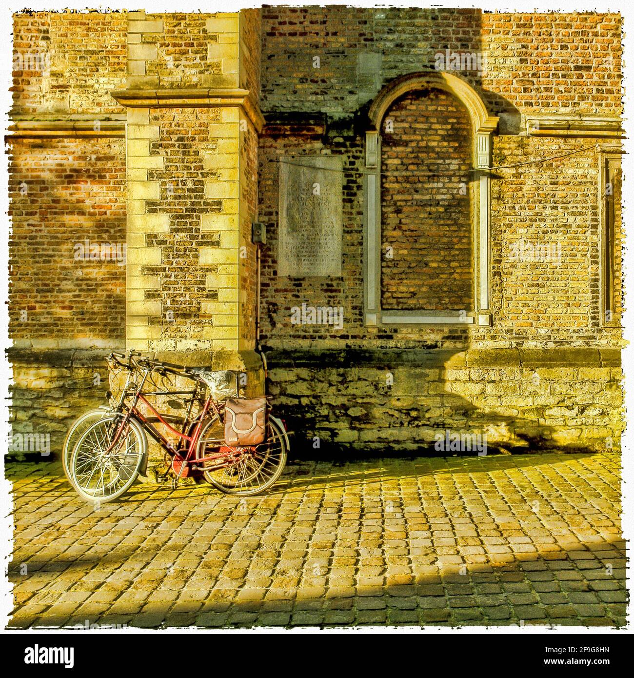Abandoned old bicycle in the old part of town Stock Photo