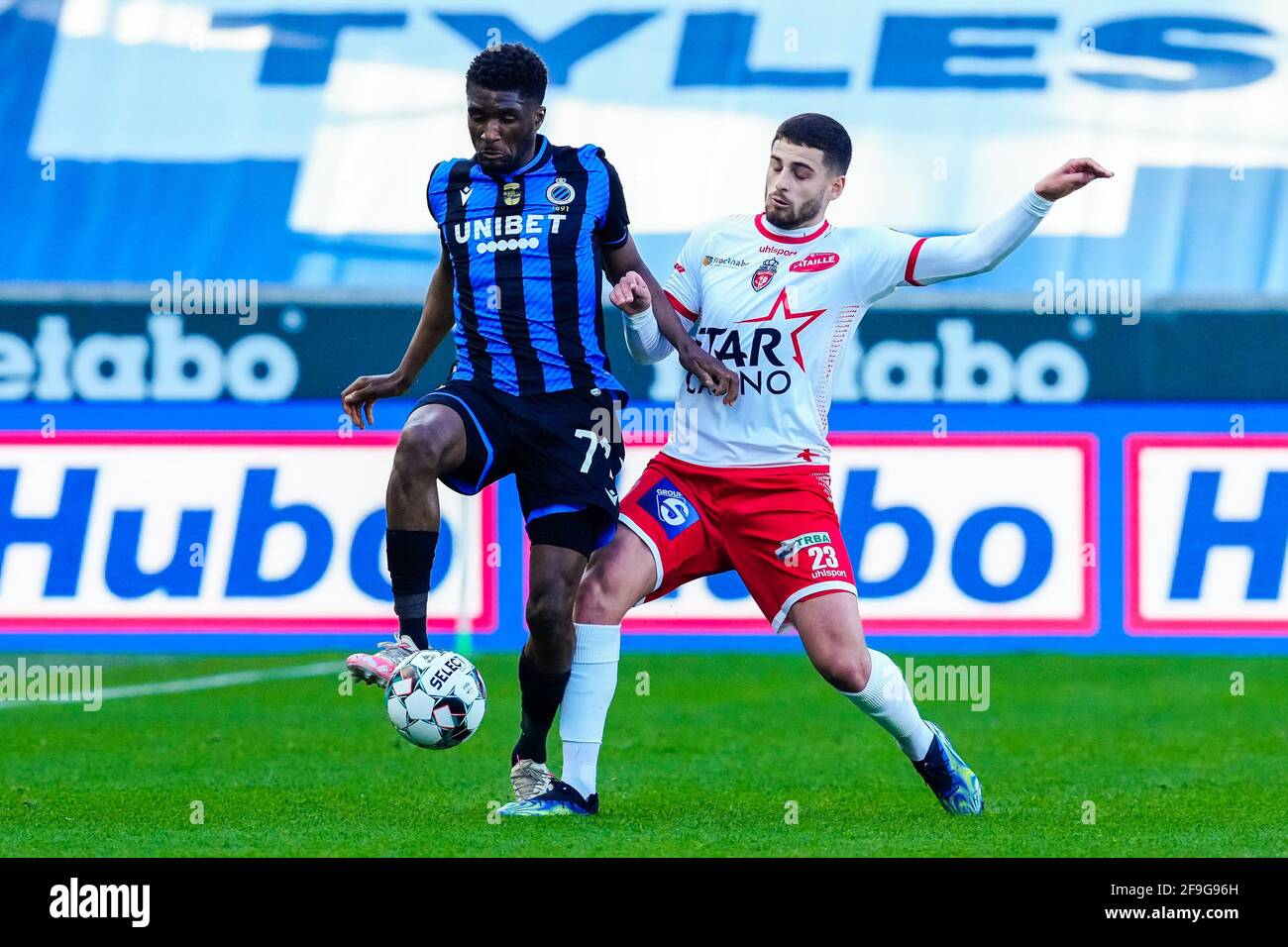 BRUGES, BELGIUM - APRIL 18: Clinton Mata of Club Brugge, Bruno Xadas of Excelsior Mouscron during the Pro League match between Club Brugge and Excelsi Stock Photo