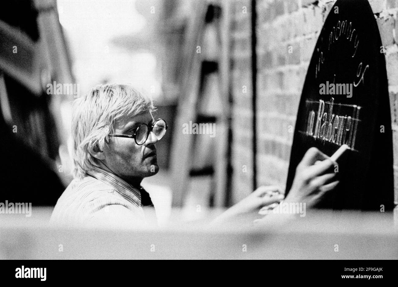 David Hockney working on his stage designs for Stravinsky’s opera THE RAKE'S PROGRESS at Glyndebourne Festival Opera, East Sussex, England  1975 Stock Photo