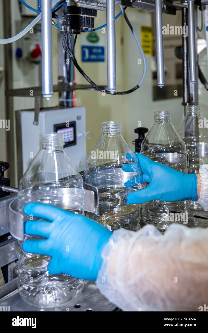 Filling milk into plastic bottles at the factory. equipment in dairy