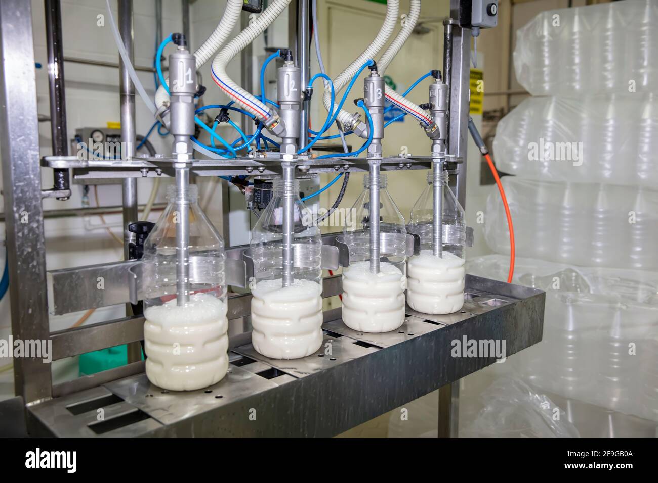 Filling milk into plastic bottles at the factory. equipment in dairy