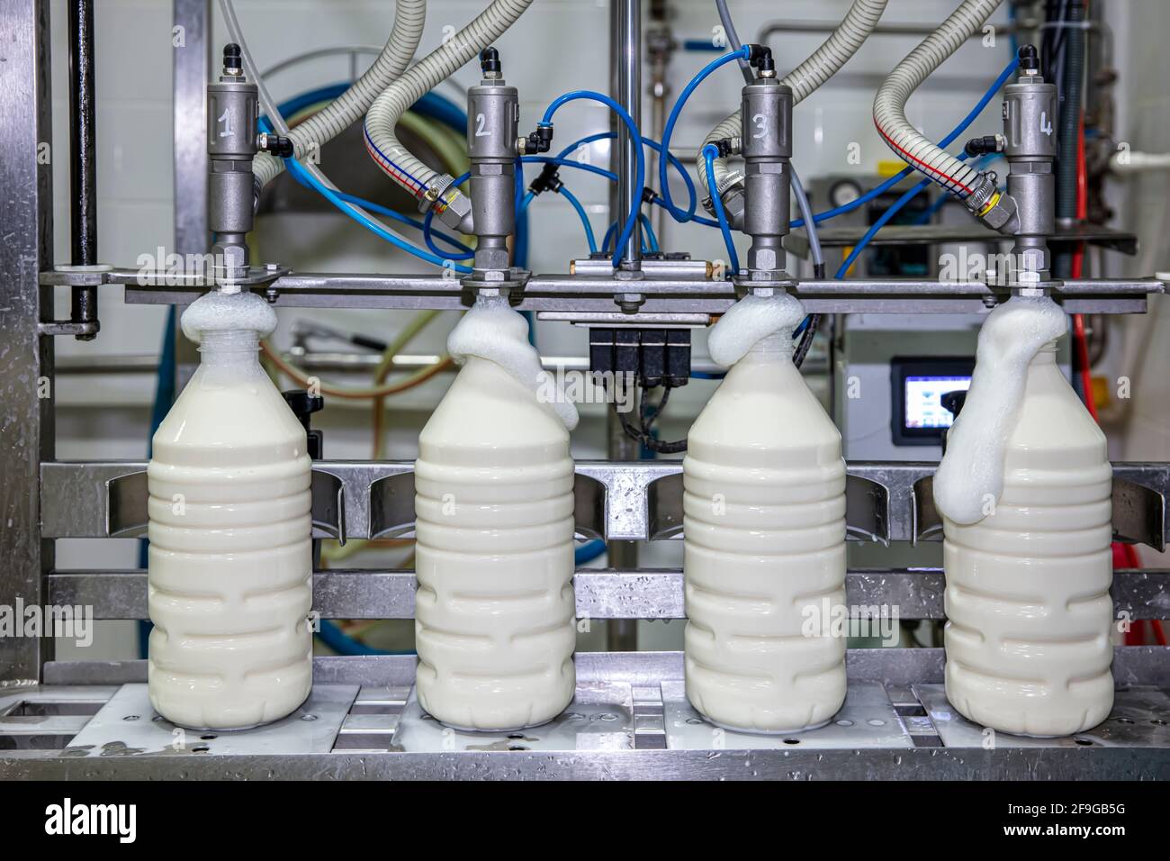 Filling milk into plastic bottles at the factory. equipment in dairy