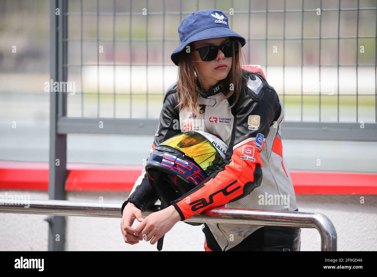 Grozny, Russia. 18th Apr, 2021. A woman motorcycle road racer looks on  during Leg 1 of the 2021 Russian Superbike Championship International Cup  held at the Krepost Groznaya racing circuit. Credit: Yelena