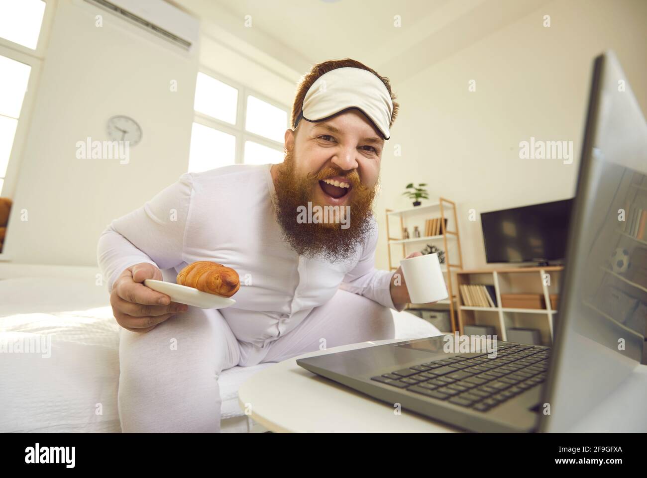 Fat man sitting bed hires stock photography and images Alamy