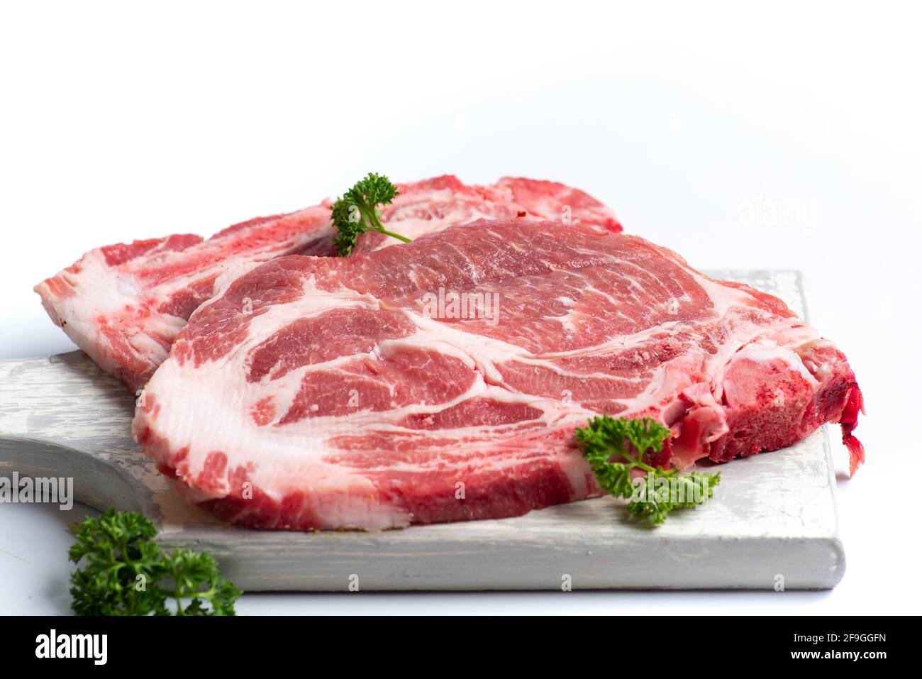 Raw pork meat slice on white background isolated Stock Photo - Alamy