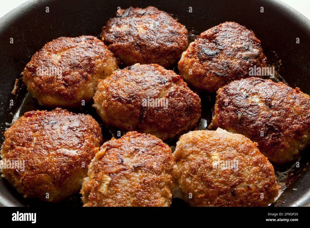 Fried meatballs in the pan, minced meat, fat Stock Photo Alamy