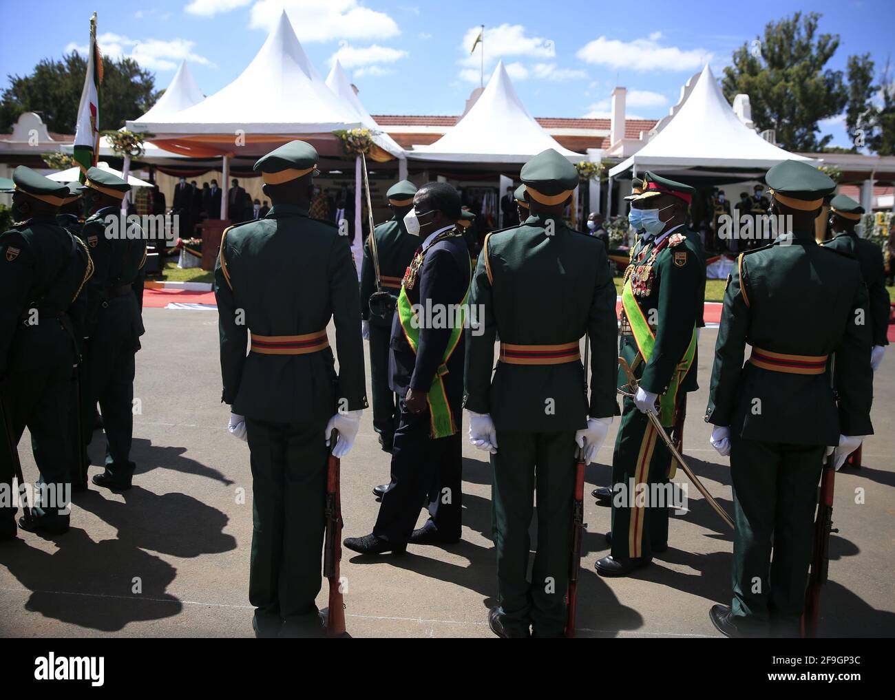 Harare, Zimbabwe. 18th Apr, 2021. Zimbabwean President Emmerson Mnangagwa (C) inspects the army during a celebration marking the 41st anniversary of Zimbabwe's Independence at State House in Harare, Zimbabwe, on April 18, 2021. Zimbabwe marked its 41st independence anniversary on Sunday, with a call by President Emmerson Mnangagwa for the nation to keep safeguarding its sovereignty. Credit: Shaun Jusa/Xinhua/Alamy Live News Stock Photo