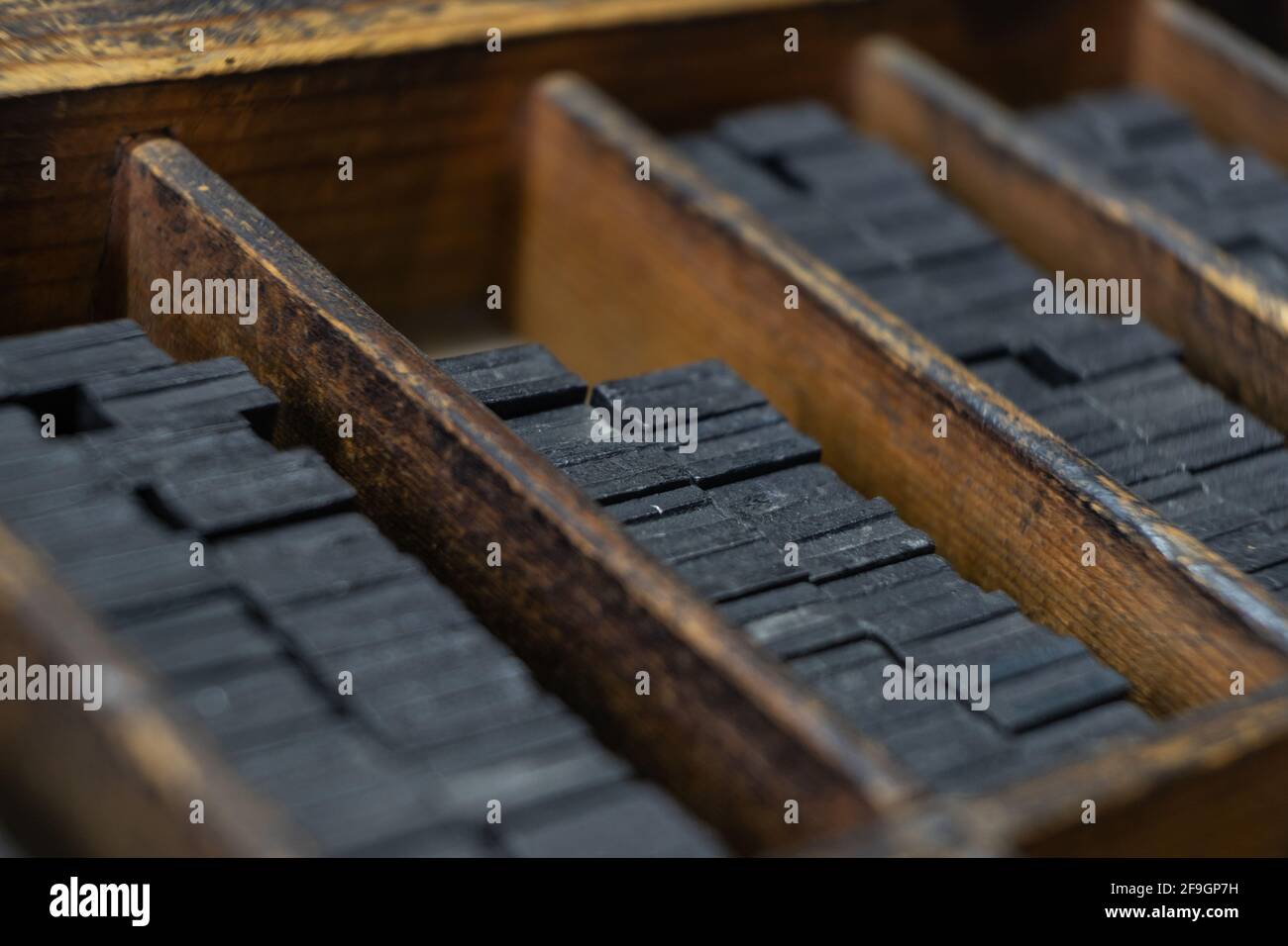 Printing press letter blocks in a wooden shelf Stock Photo Alamy