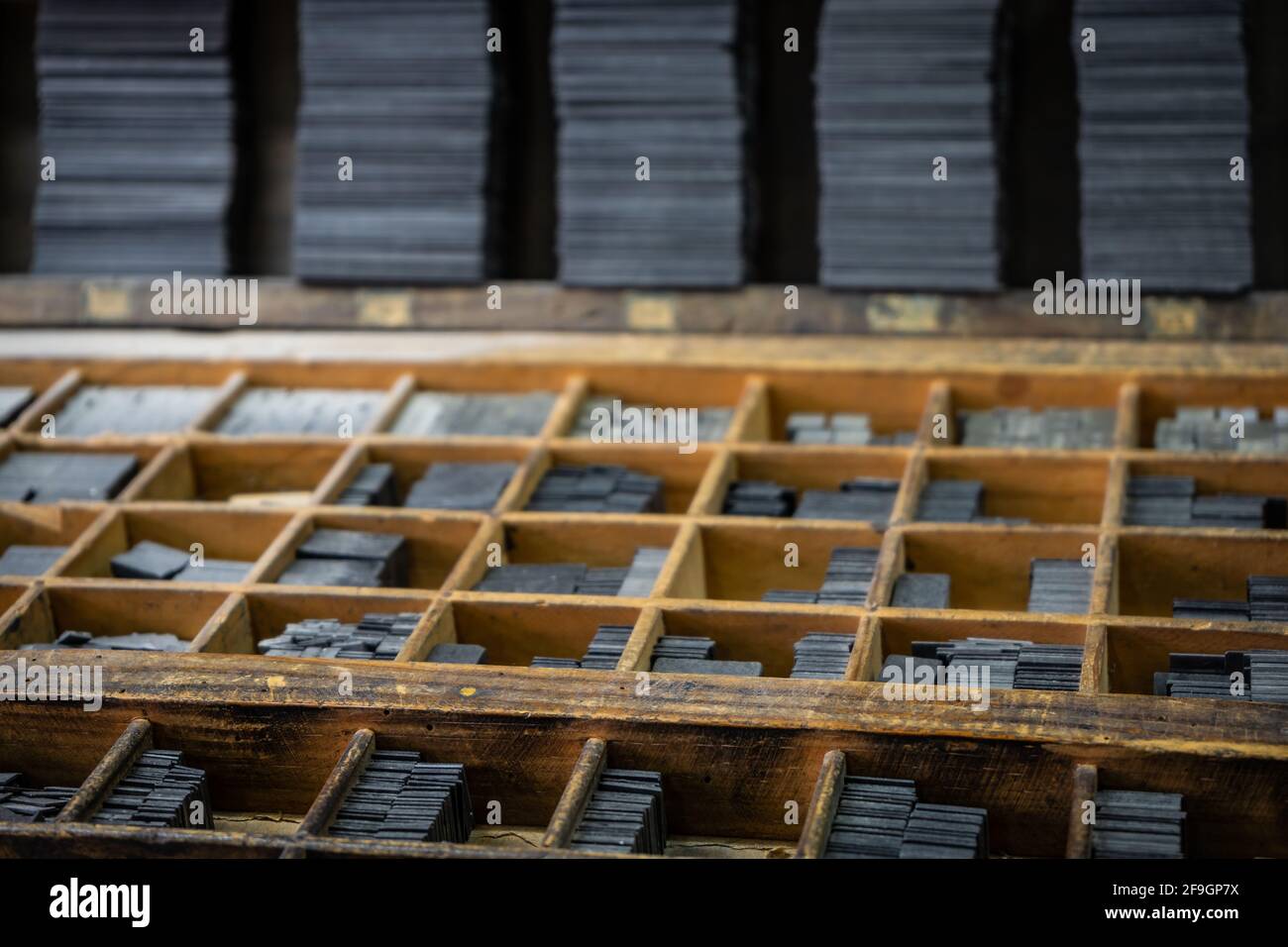 Printing press letter blocks in a wooden shelf Stock Photo Alamy