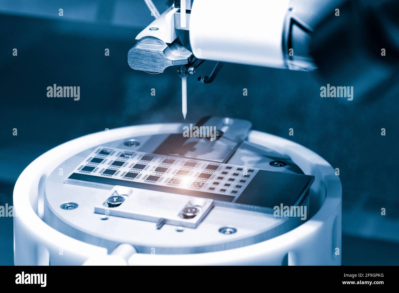 Close up of examining of test sample of microchip transistor under the microscope in laboratory. Equipment for testing microchips. Automation of produ Stock Photo