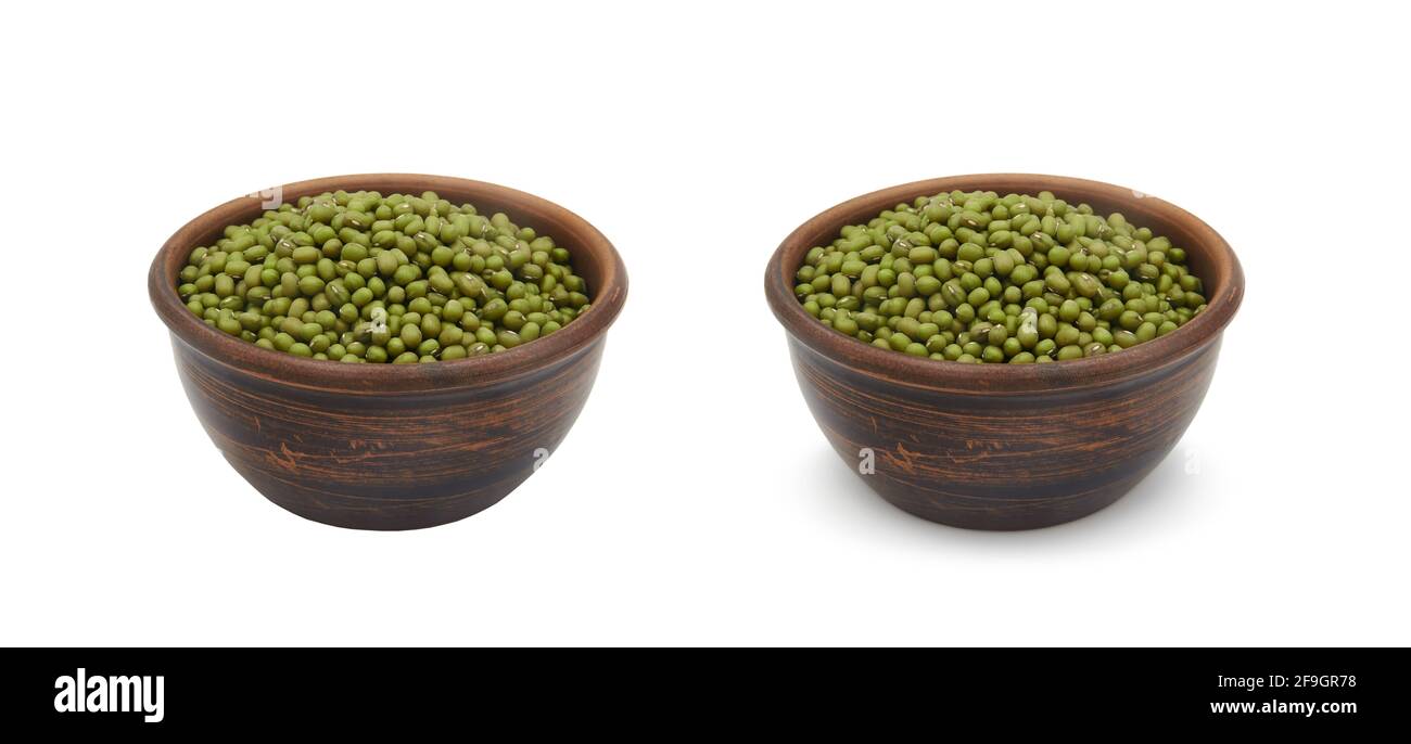 mung beans in simple clay bowl on white background, isolated and with shadow Stock Photo