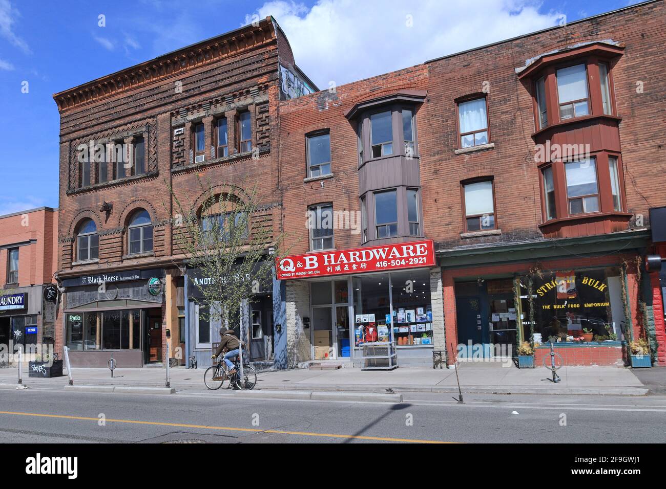 Toronto, Canada - April 18, 2021:  Vintage architecture and eclectic businesses on Bloor Street near downtown Toronto. Stock Photo