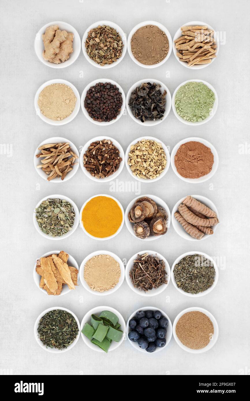 Adaptogen healthy food with fruit, herb, spices & supplement powders. Natural plant based foods that help the body deal with stress. Stock Photo