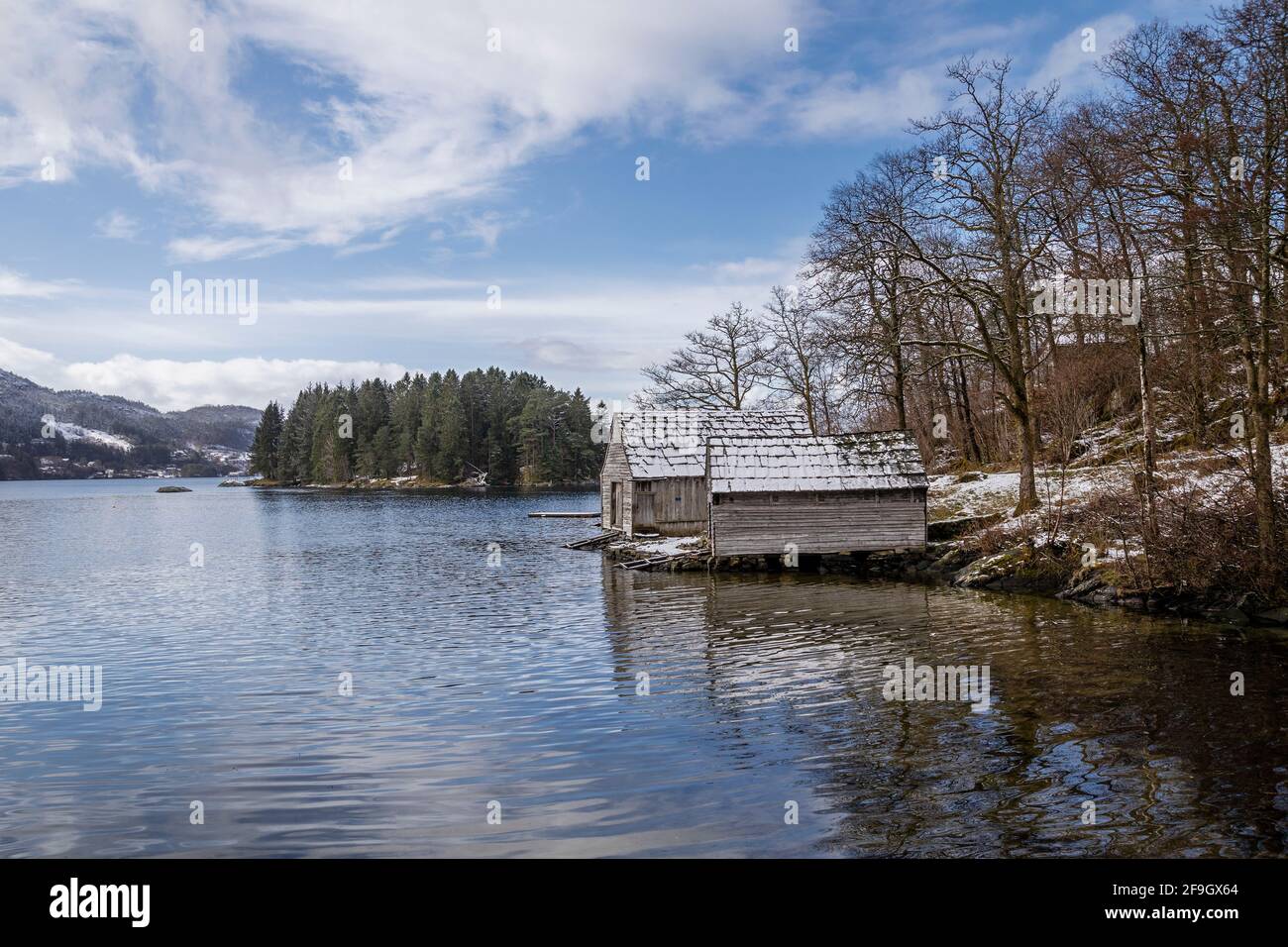 From Hordamuseet open air museum at Stend, by the Fana fjord, Norway. Late winter. Boathouses, old building styles from Hordaland and west coast Norwa Stock Photo