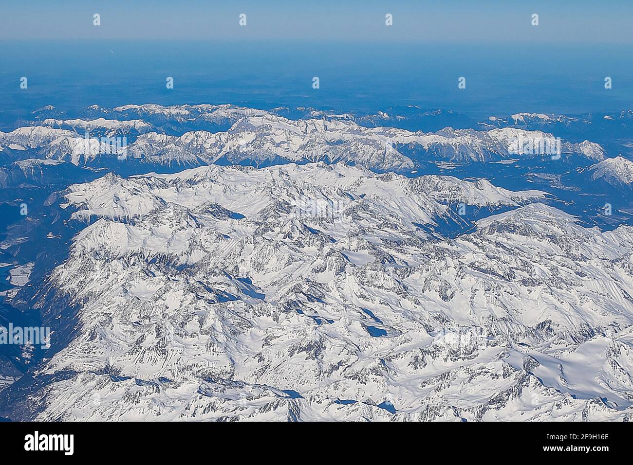 Aerial view of snowy mountains in a sunny day Stock Photo - Alamy