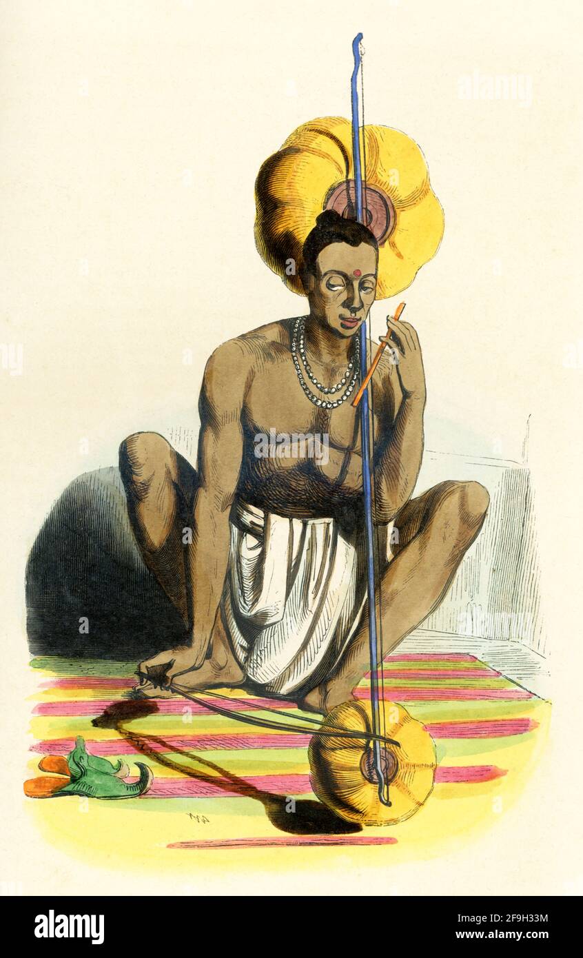 This 1840s illustration shows a Hindu man playing a pena, Pena, also known as Tingtelia, is a mono string instrument falling in the lute category, similar to some of the traditional Indian stringed musical instruments such as Ravanahatha, Ubo or the Kenda, found in various parts of the country. Stock Photo