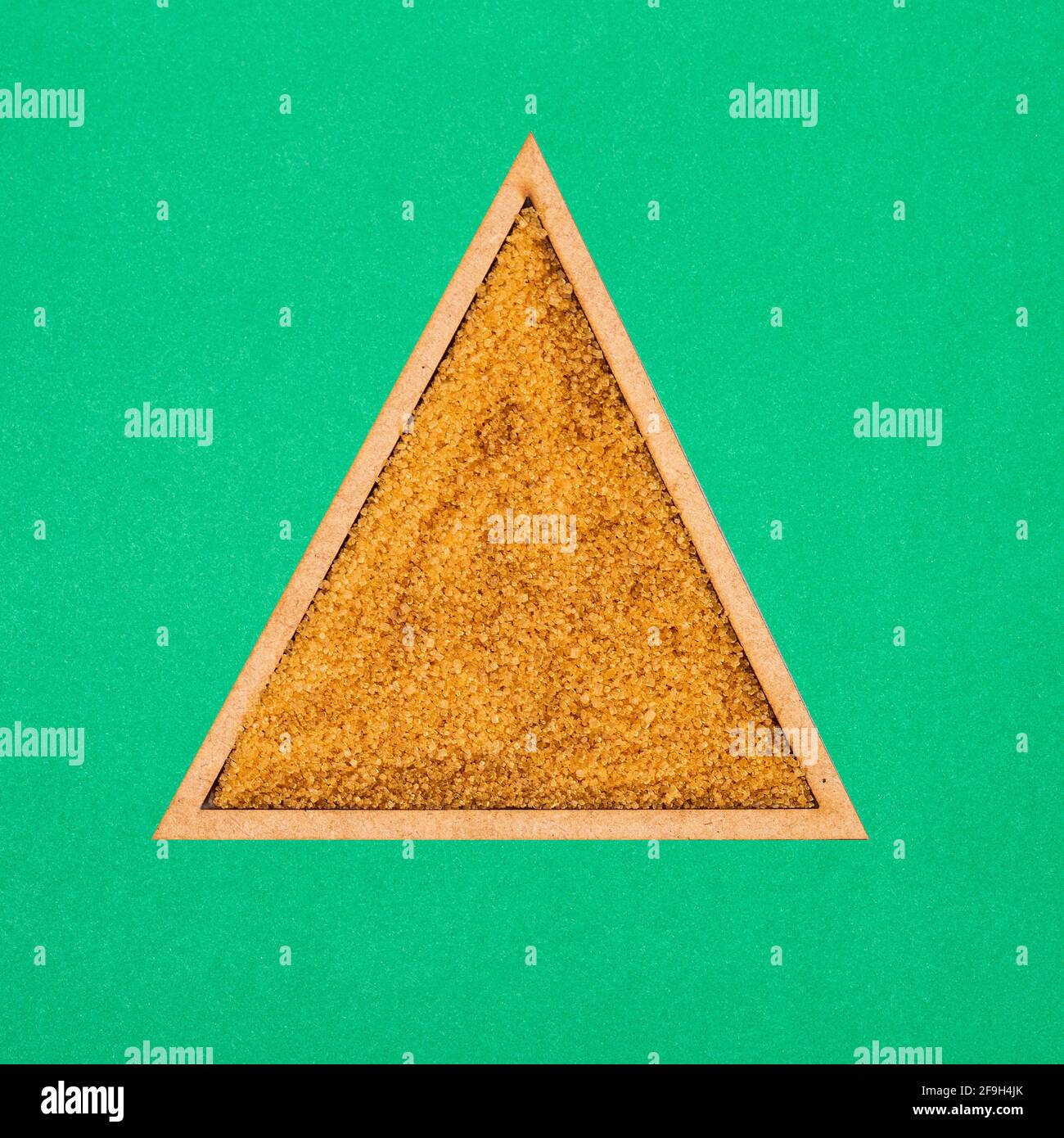 organic-brown-sugar-in-the-triangle-bowl-saccharum-officinarum-stock