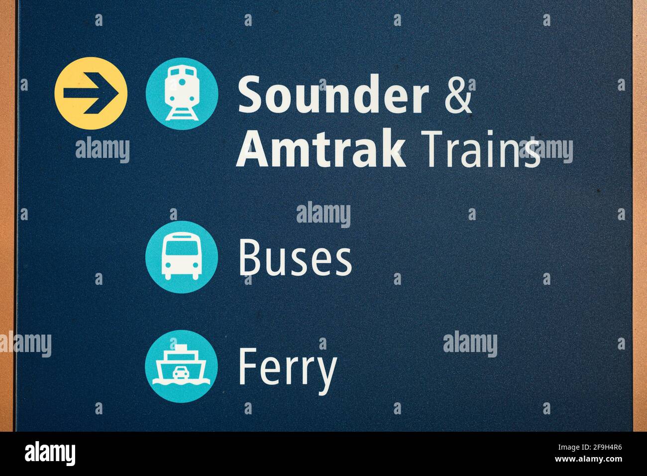 Interconnected transit system sign in Edmonds  for Sounder local train service, Amtrak passenger train network, Greyhound and Community Transit buses Stock Photo