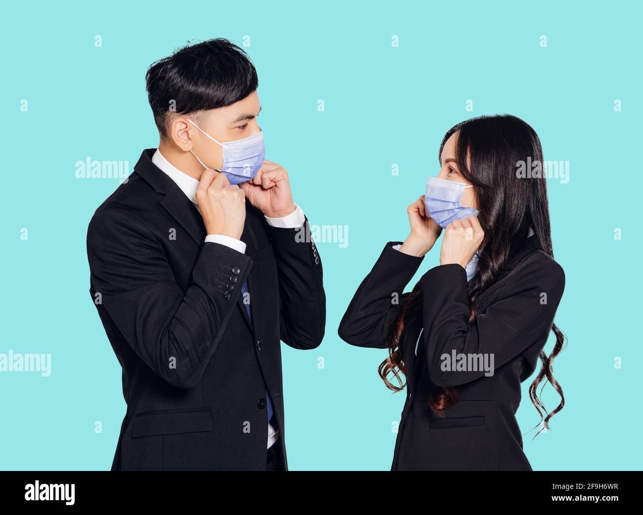 young asian business man and woman wearing mask Stock Photo - Alamy
