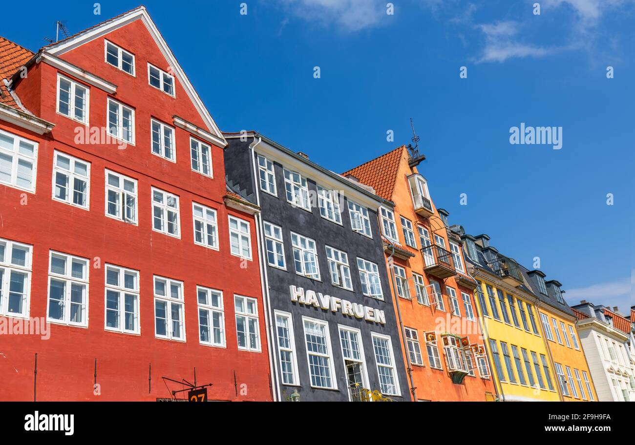 Copenhagen, Denmark-2 August, 2020: Famous Nyhavn, New Harbour, bay in Copenhagen, a historic European waterfront with colorful buildings. A starting point for boat and canal tours. Stock Photo