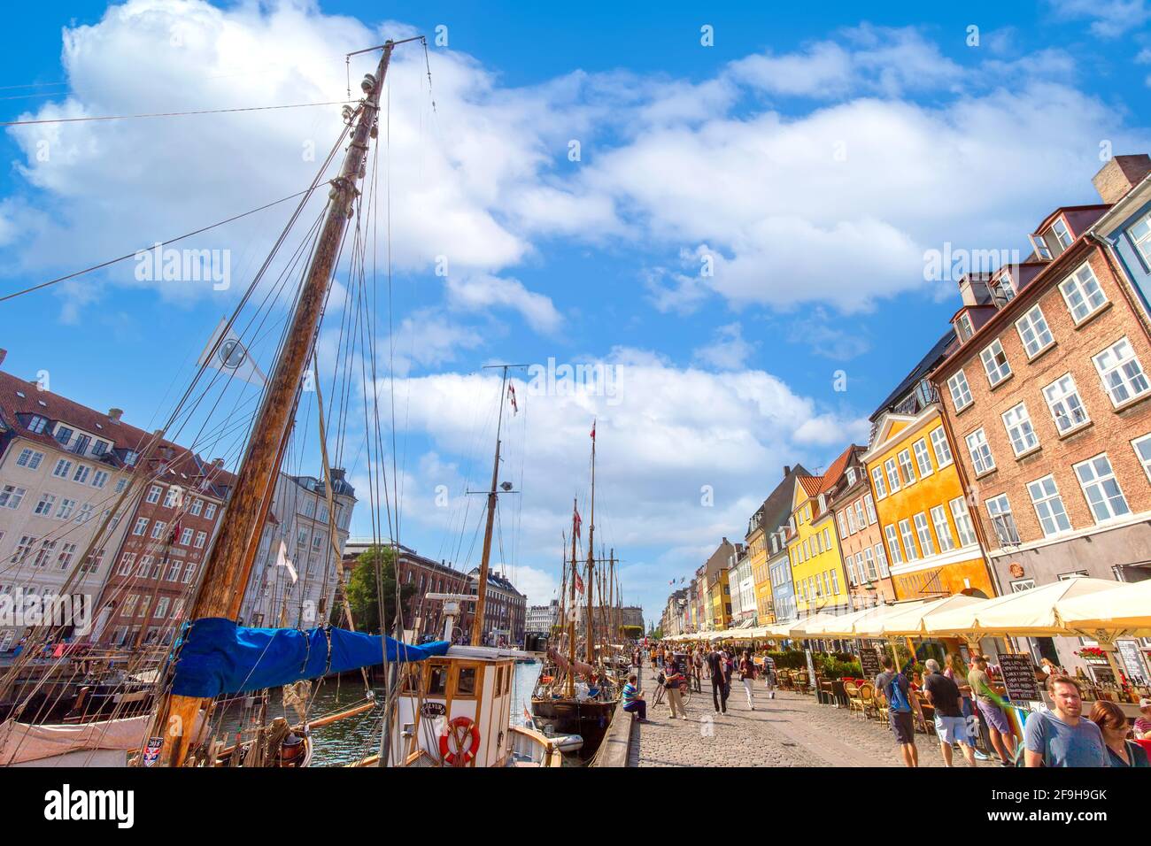 Copenhagen, Denmark-2 August, 2020: Famous Nyhavn, New Harbour, bay in Copenhagen, a historic European waterfront with colorful buildings. A starting point for boat and canal tours. Stock Photo