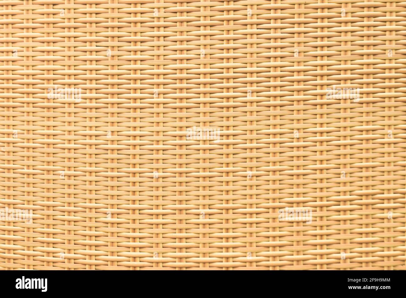 Yellow rattan wood texture and background Stock Photo - Alamy