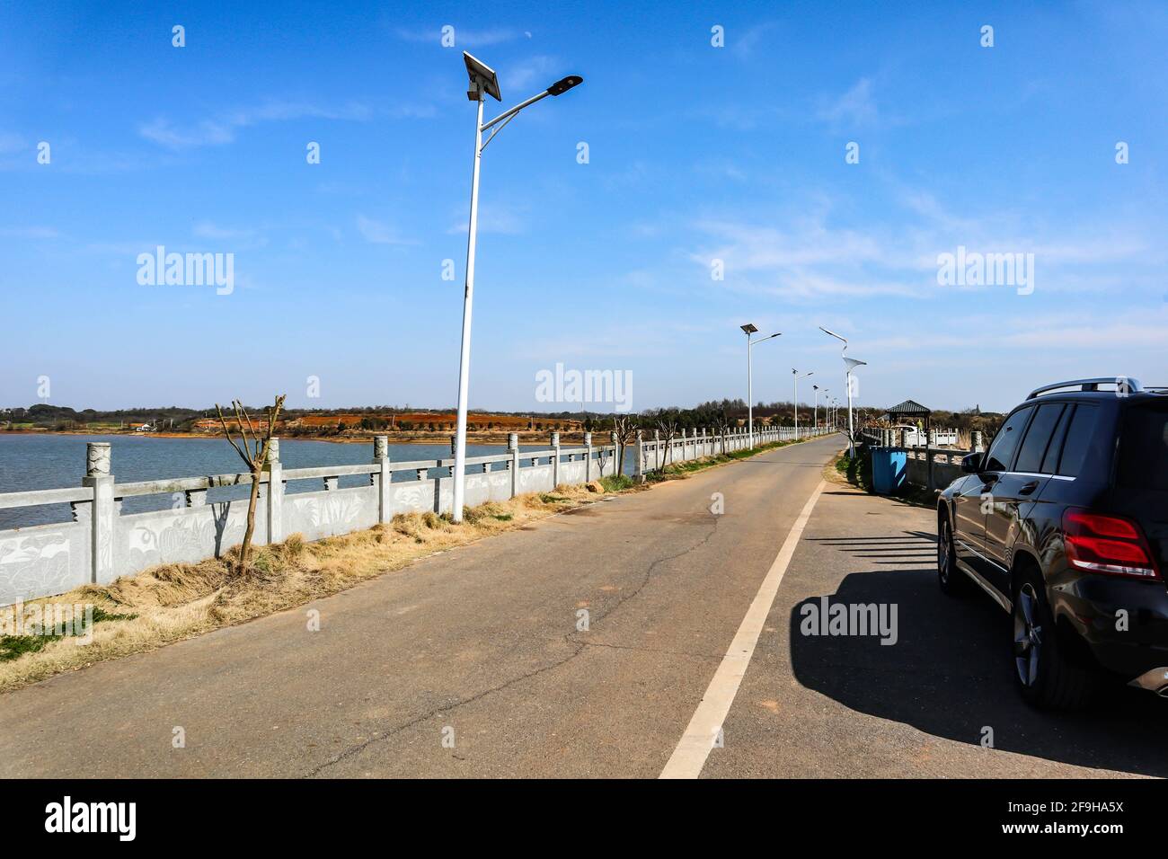 People park their cars in a roadside parking lot Stock Photo Alamy