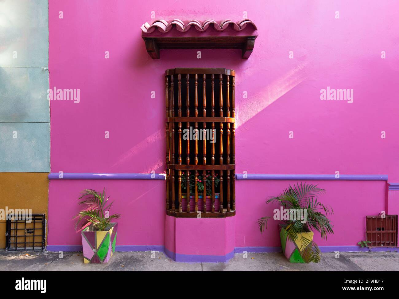 Scenic colorful streets of Cartagena in historic Getsemani district near Walled City, Ciudad Amurallada. Stock Photo