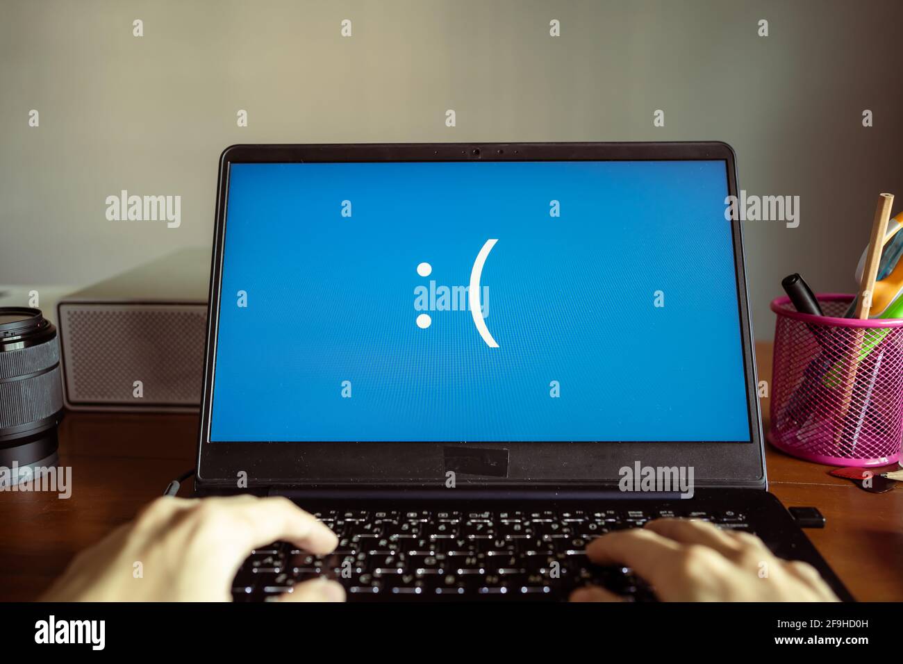 Laptop computer showing its screen with blue screen when it has a system error Stock Photo