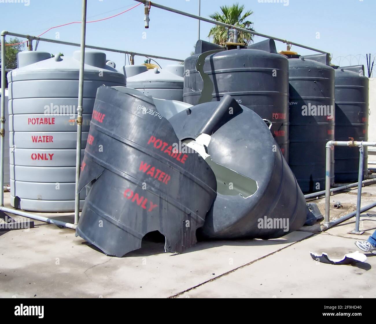 Plastic water tanks destroyed by an explosion at a Forward Operating