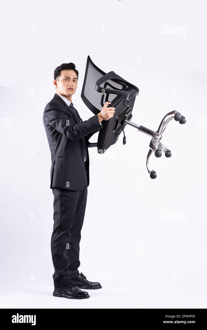Image of young Asian businessman wearing suit on white background Stock ...
